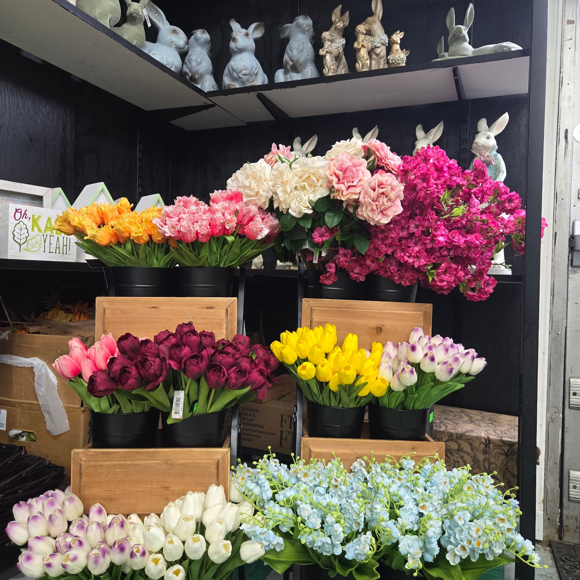 Real-touch silk tulips, hydrangeas and blossom in crates and buckets